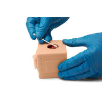 Load image into Gallery viewer, CAE Medicor MultiCUBE Trainer Model for Urinary Catheterization - Light - American Hospital Supply
